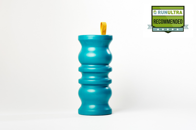 Picture of the manta foam roller in a sea turquoise colour, with a bright yellow finger loop at the top. Run Ultra recommended badge in the top right corner, with 5 stars.  